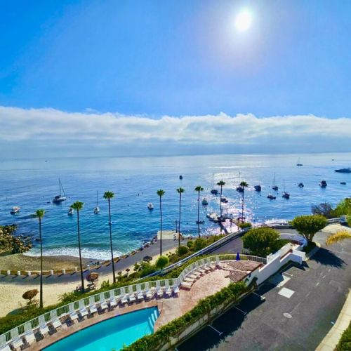 Wake up to panoramic ocean views, swaying palms, and a sparkling pool by the beach.
