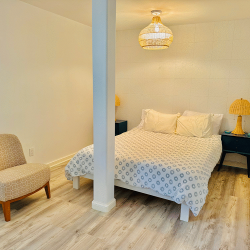 - Simple, serene, and softly lit, this bedroom is all about rest and recharge
- Earthy textures and warm lighting create a calming, beach inspired retreat
- Whether it’s a lazy morning in bed or a peaceful night’s sleep, comfort comes easy here