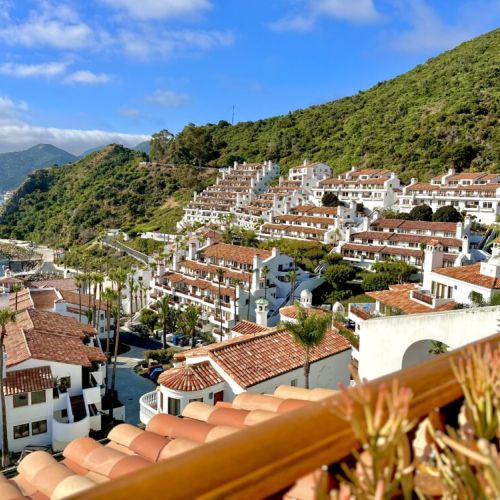 Discover a Mediterranean inspired hillside village overlooking the Pacific, nestled in beautiful green cliffs.