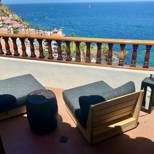 - Two cozy loungers and a side table set the vibe for epic sea gazing and breezy naps
- Watch sailboats glide by or toast the sunset in your private coastal nook
- This is your VIP ticket to blue horizons and pure island calm