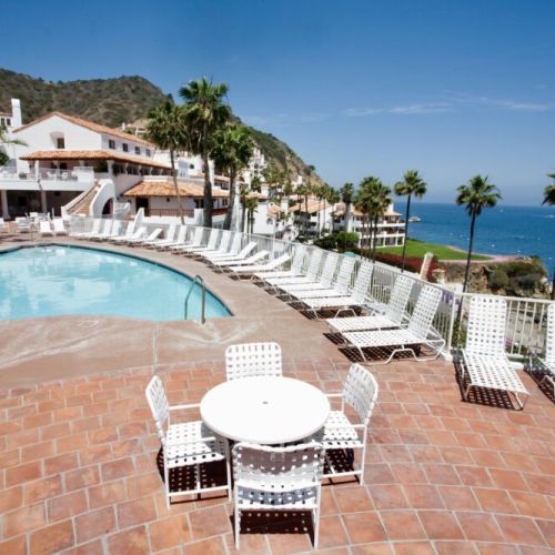 Dive into island relaxation at this scenic poolside escape with sweeping coastal vistas.